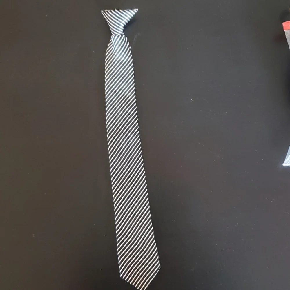 Boys black and white striped Polyeste clip on tie.